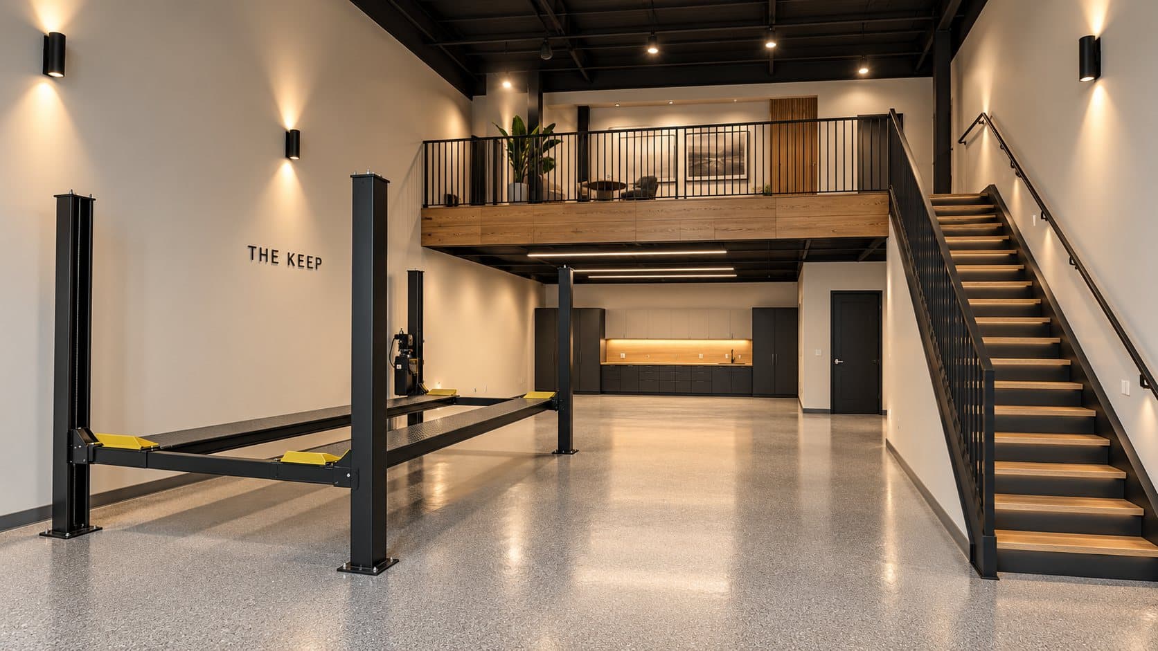 Artist's concept of a suite with a four-post lift, built-in cabinetry, and a mezzanine office