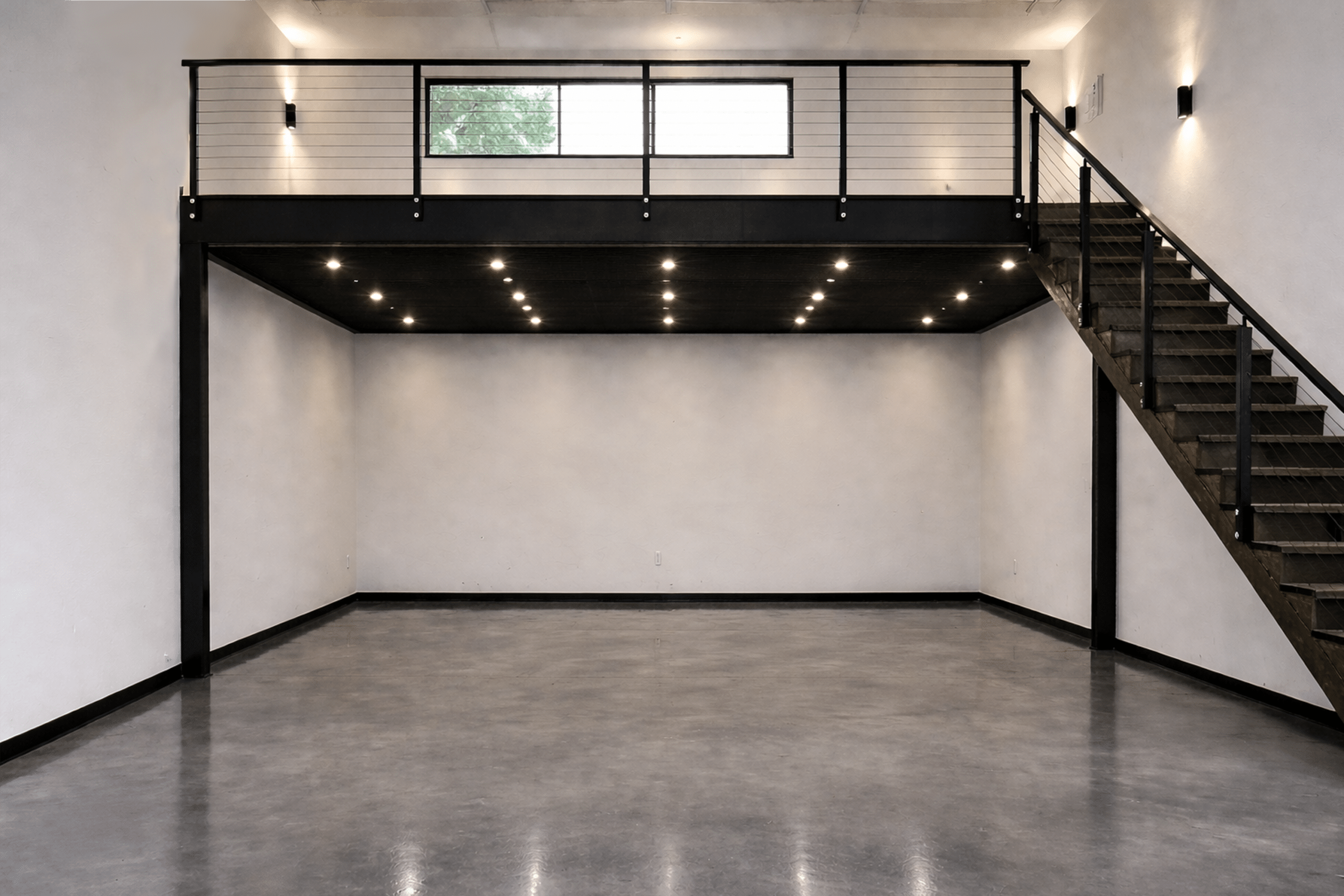Classic car collection inside a premium private garage suite at The Keep